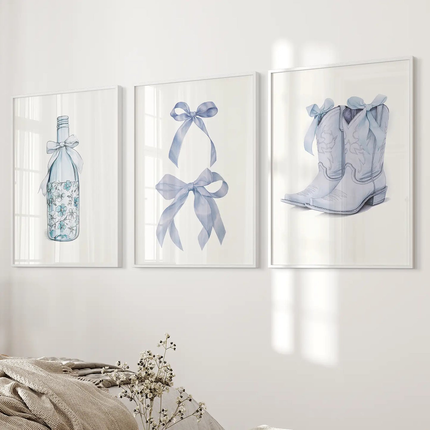 Floral wine bottle art print set with cowboy boots and ribbons.White frames over the bed.