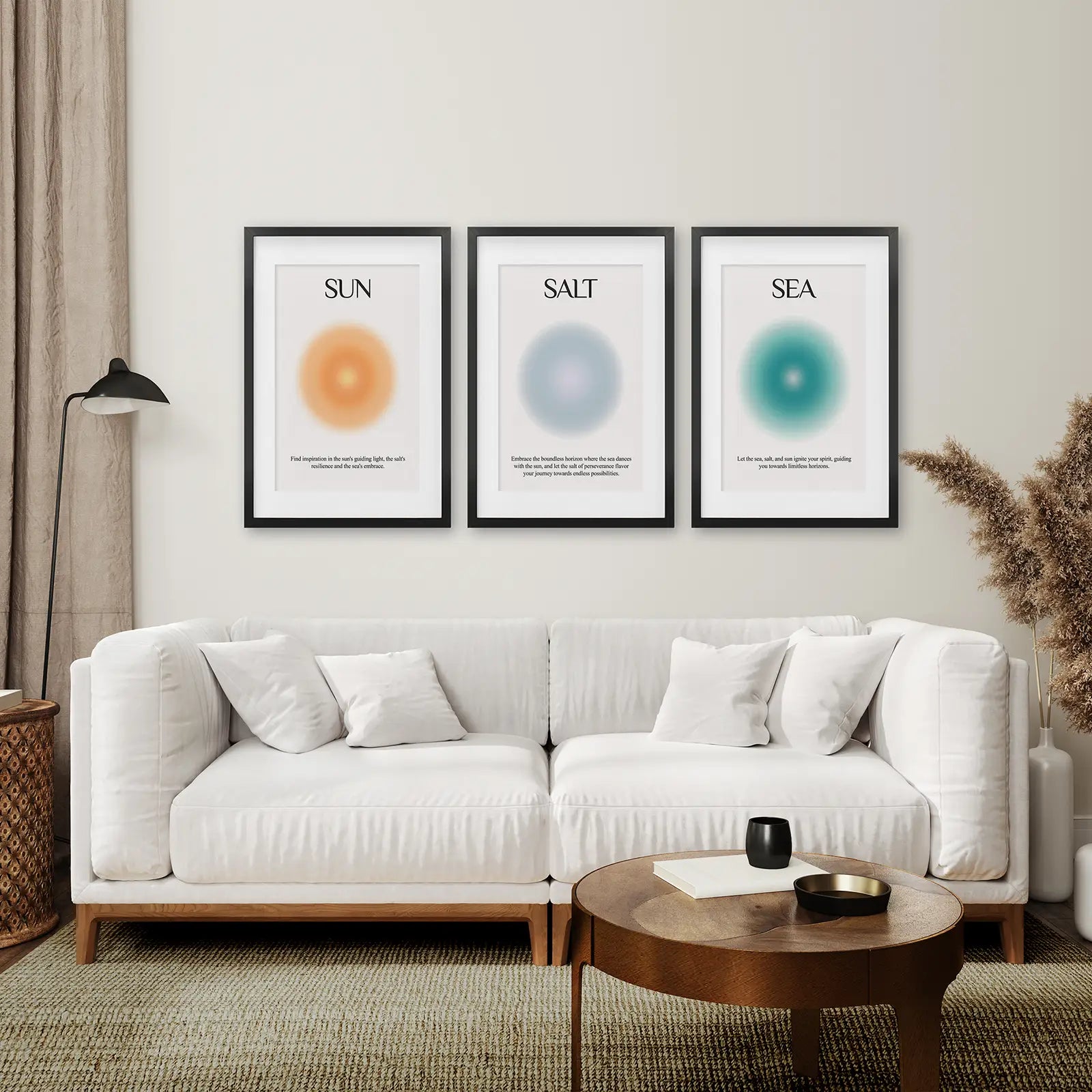 Modern abstract Sun Salt Sea poster trio with inspirational quotes. Black frames with mat over the couch.