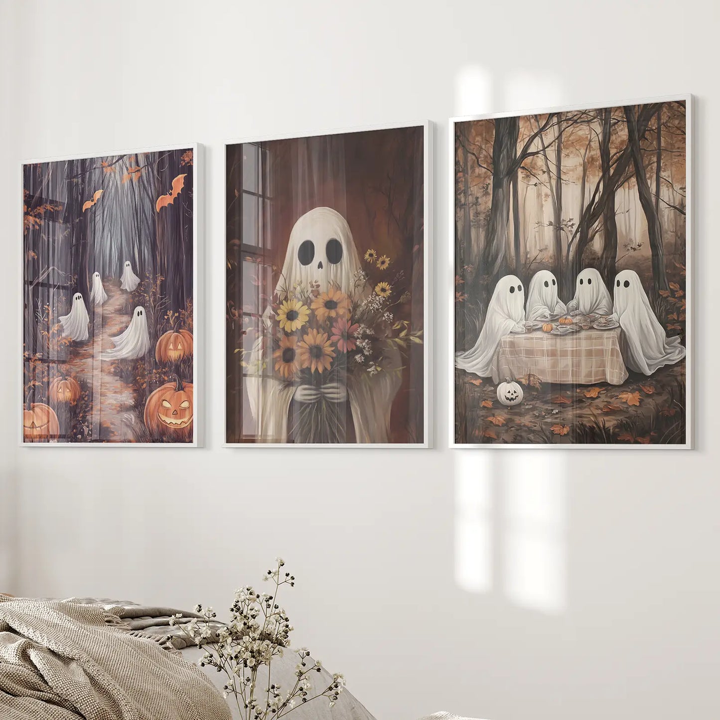 Trendy ghost with flowers autumn seasonal decor. White frames over the bed.