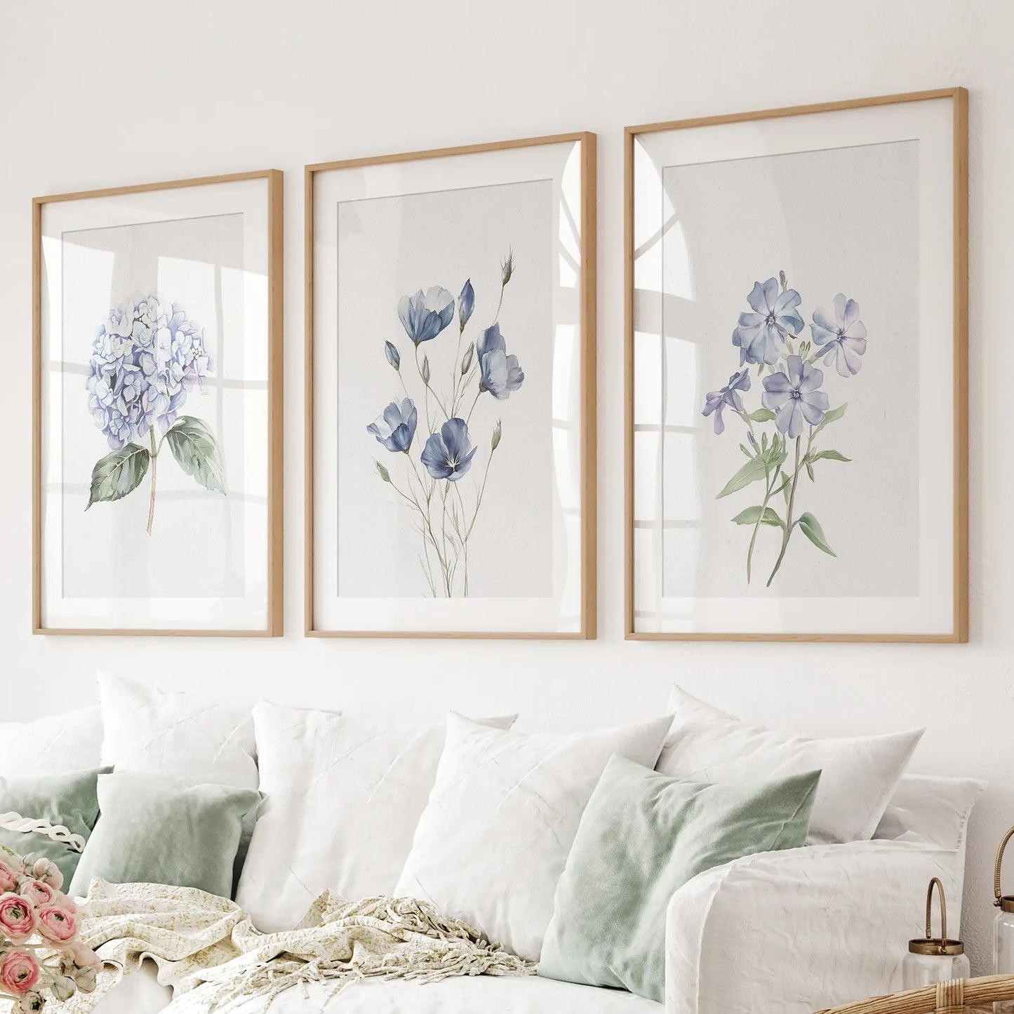 Minimalist colorful wall decor, floral prints trendy art. Thinwood frames with mat over the couch.