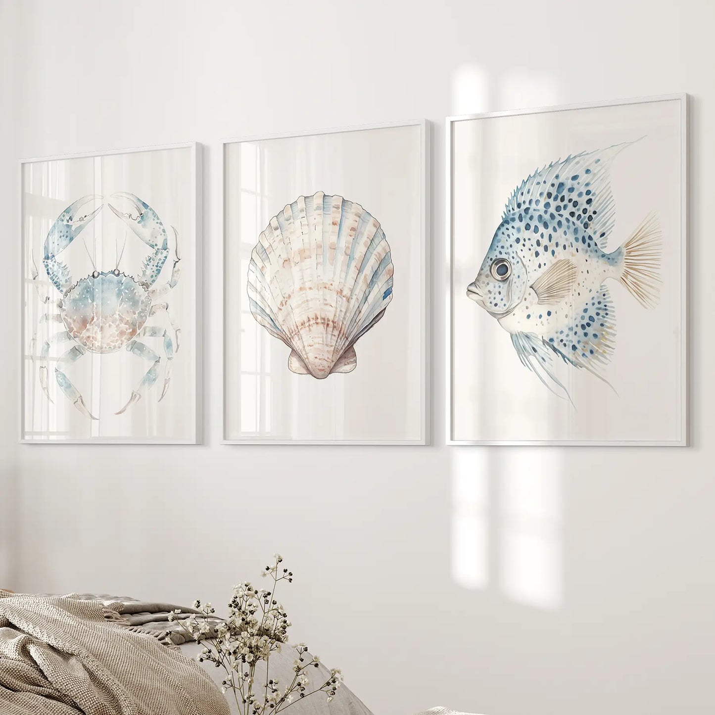 Watercolor ocean large prints. Ocean themed wall prints. White frames over the bed.