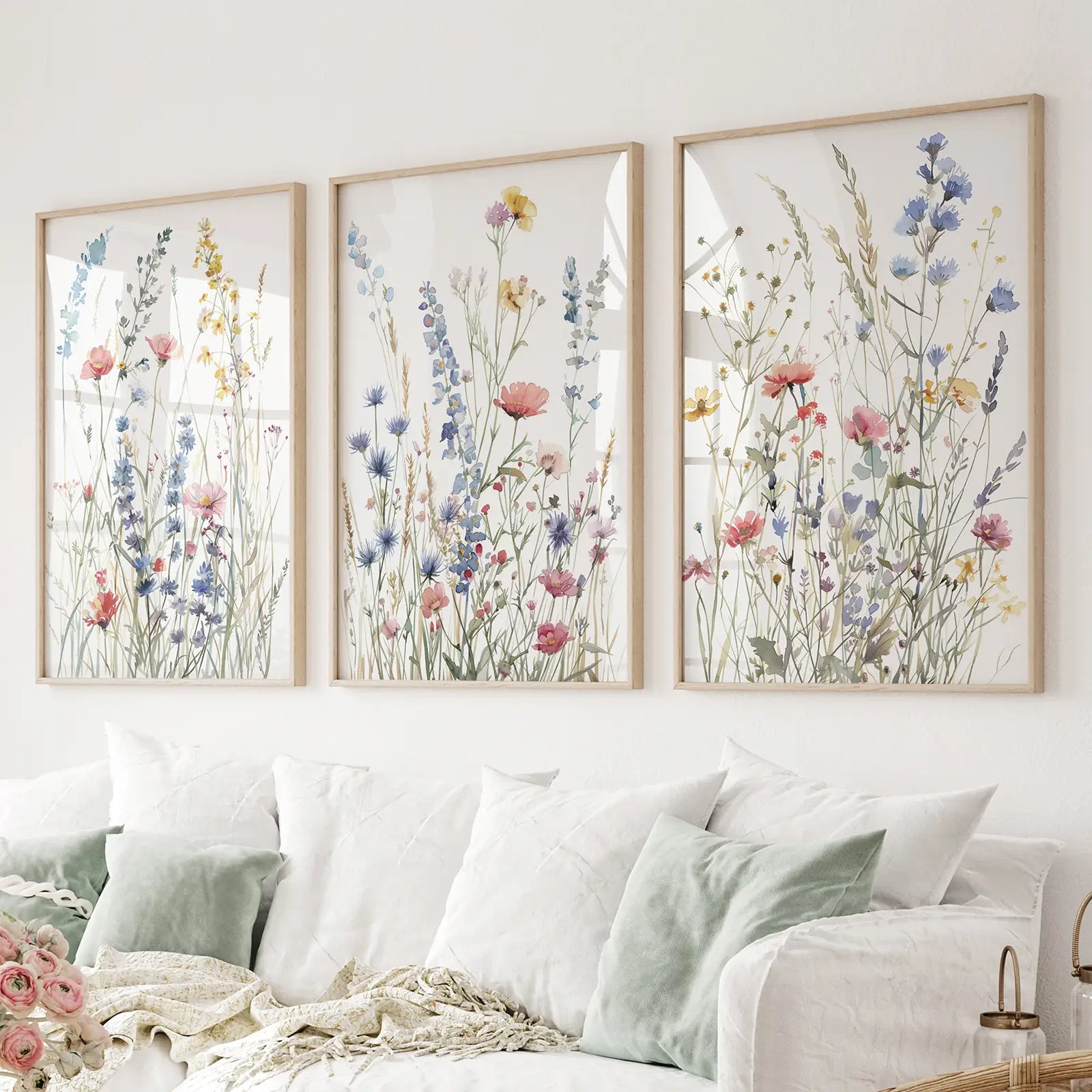 Wildflower watercolor triptych wall art set of 3 prints. Thinwood frames over the couch.