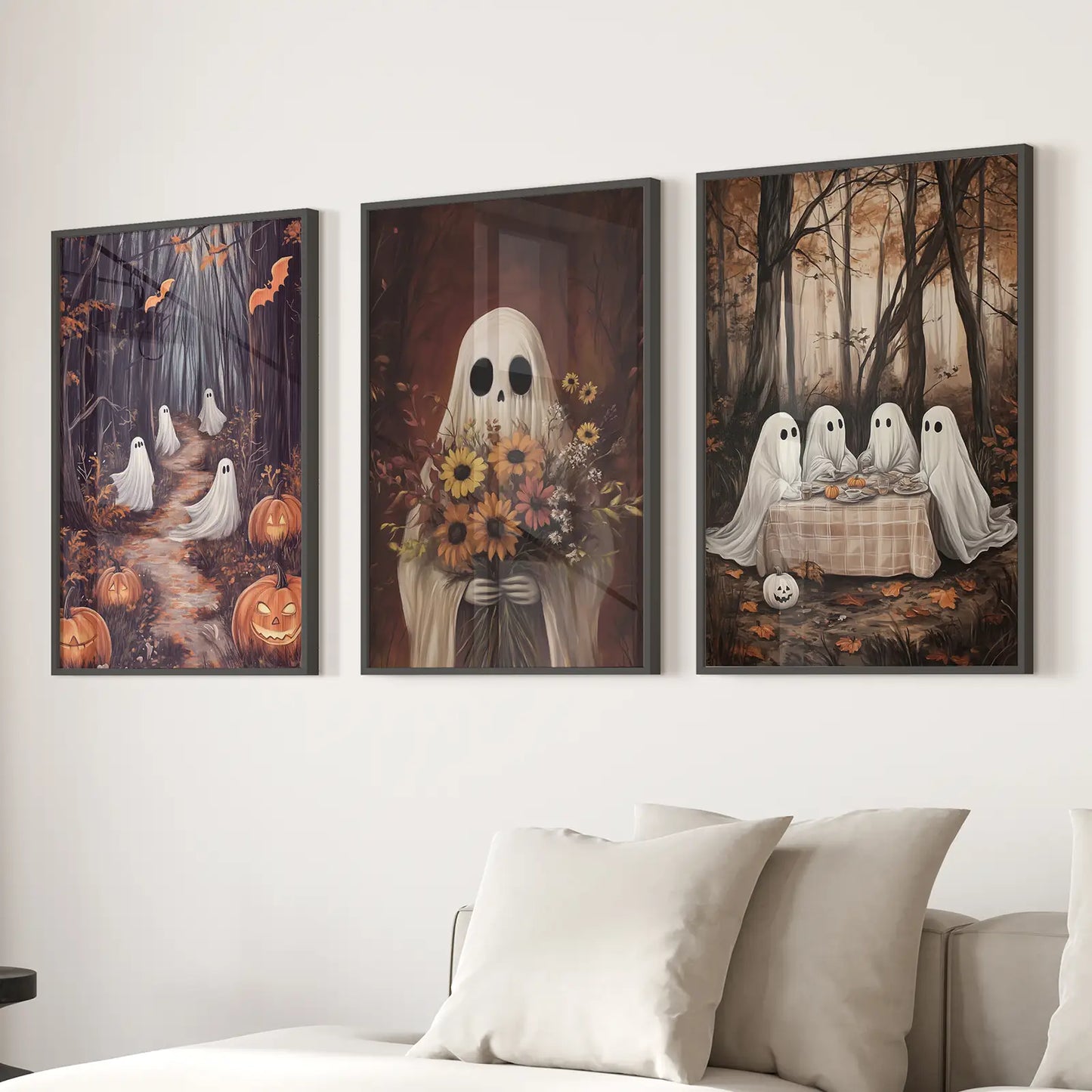 Cozy Halloween wall decor featuring cute ghost illustrations. Black frames for living room.