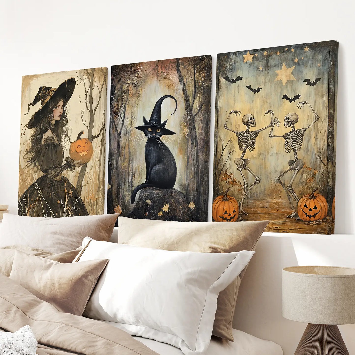 Spooky witch, cat, and skeleton prints for Halloween home decor. Stretched canvas over the bed.