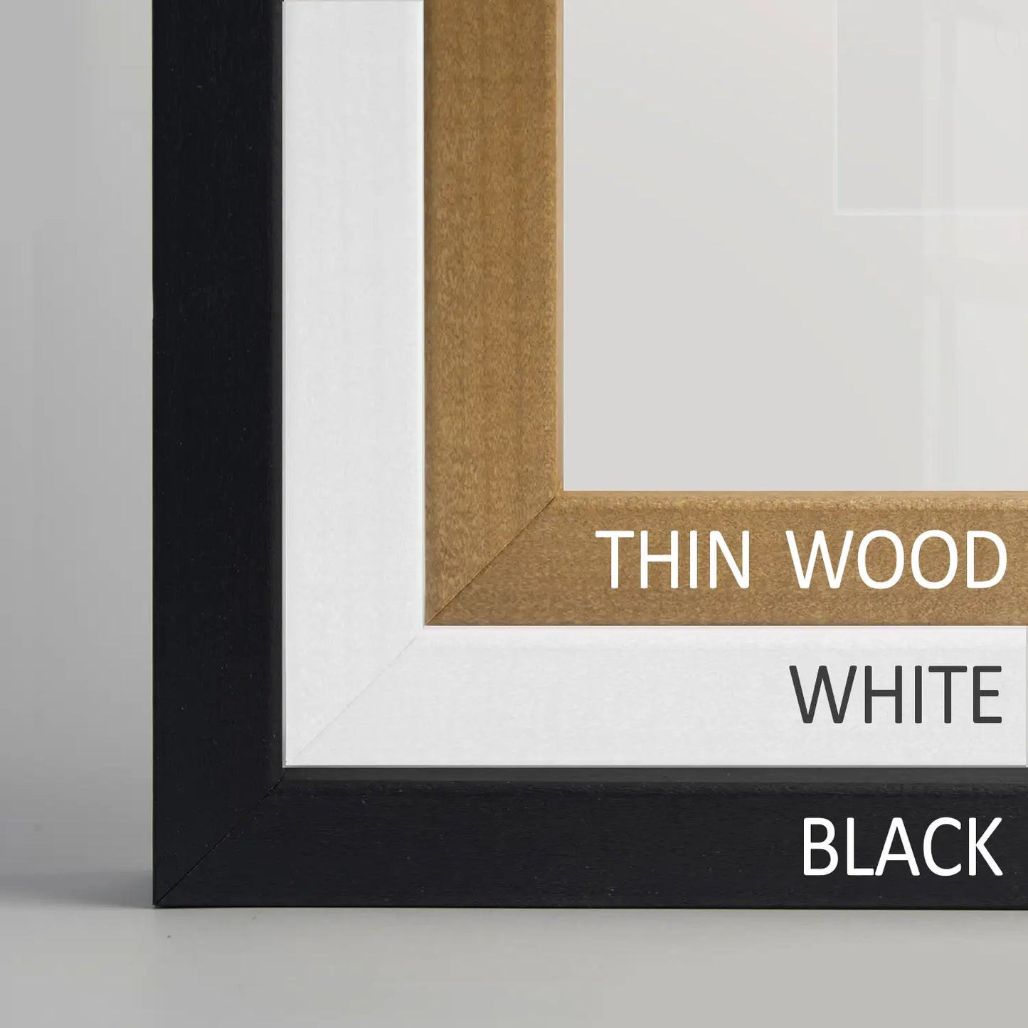 Frame profiles closeup. Thin wood, black, white