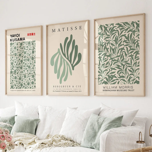 Modern gallery wall with Kusama dots, Matisse abstract leaf, Morris botanical print trio. Thinwood frames over the couch.