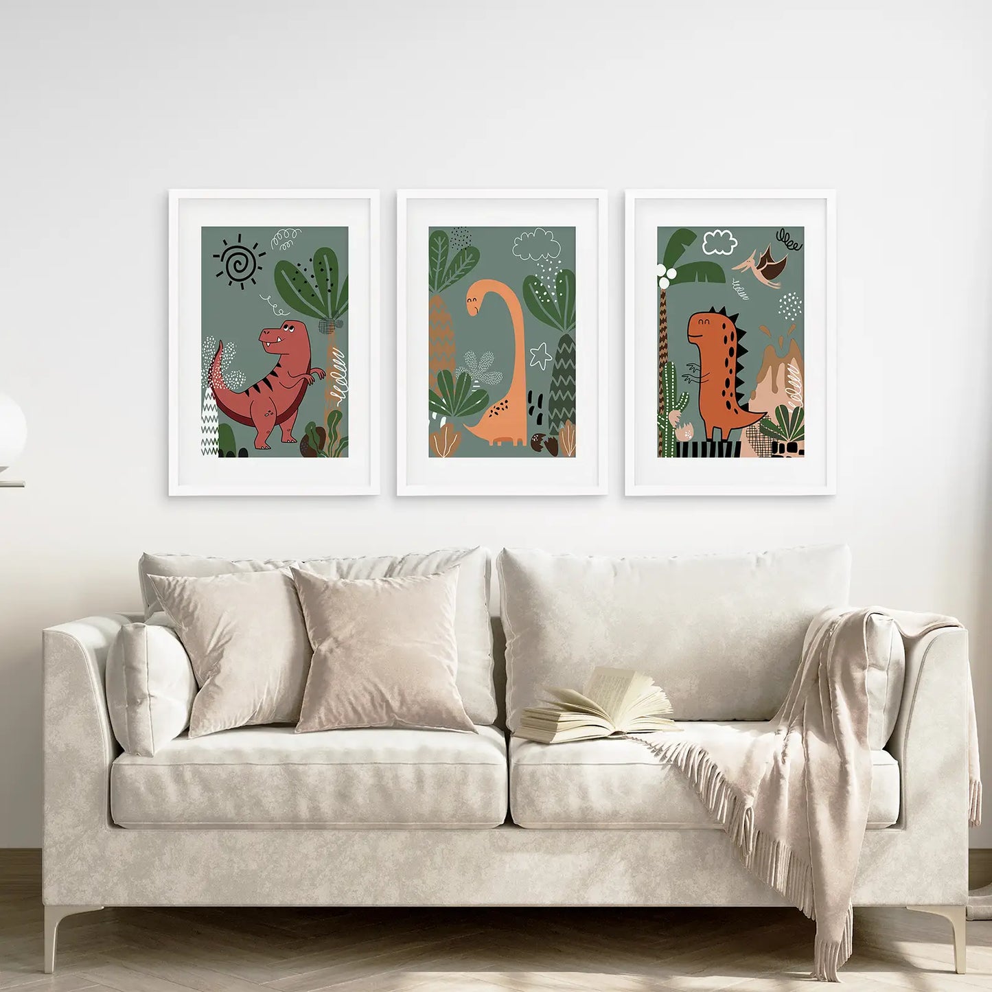 Funny dinosaur illustrations in soft colors, wall art prints for baby room. White frames with mat above the sofa.