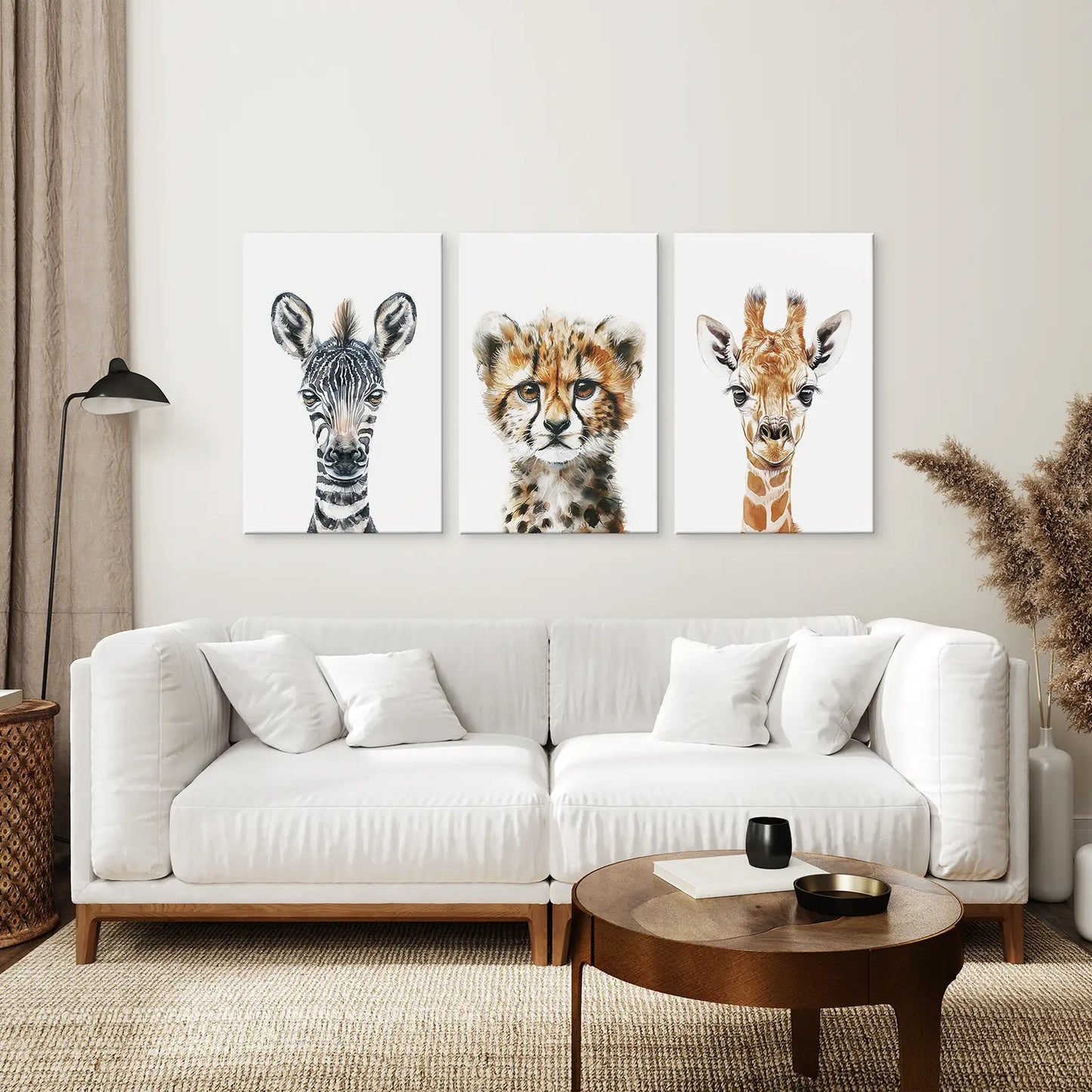 Modern jungle animal triptych featuring zebra, baby cheetah, and giraffe wall art for kids’ room. Wrapped canvas over the couch.