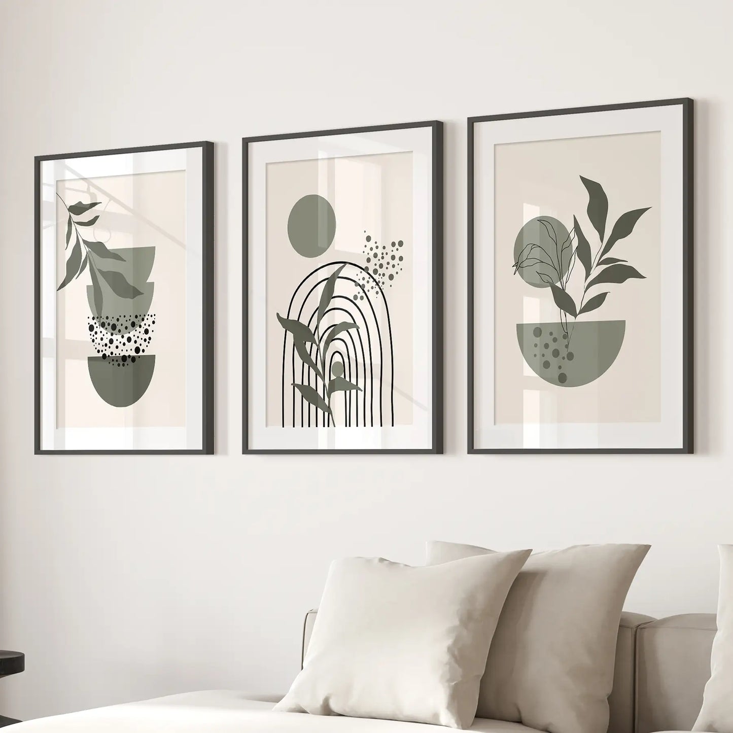 Modern minimalist botanical prints abstract home decor. Black frames with mat over the couch.