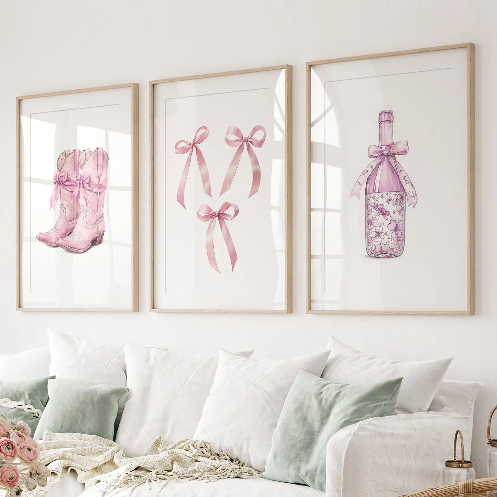 Floral wine bottle art print with pink ribbon – chic kitchen and bar wall decor. Thinwood frames with mat over the couch.