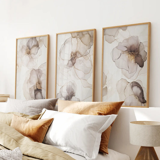 Abstract floral wall art set of 3 featuring beige and gray watercolor flowers with gold accents, modern prints. Thinwood frames for bedroom.