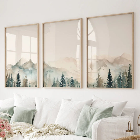 Watercolor mountain landscape wall art set of 3 prints triptych with pine trees. Thinwood frames above the sofa.