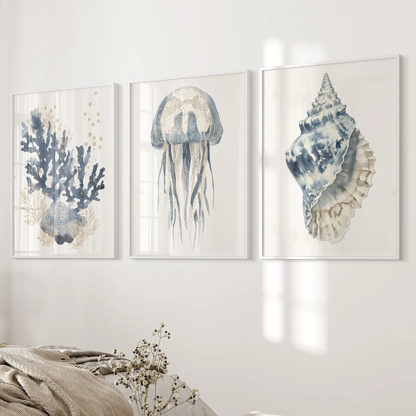 Nautical ocean beach house watercolor posters. Minimalist coastal wall decor. White frames above the bed.