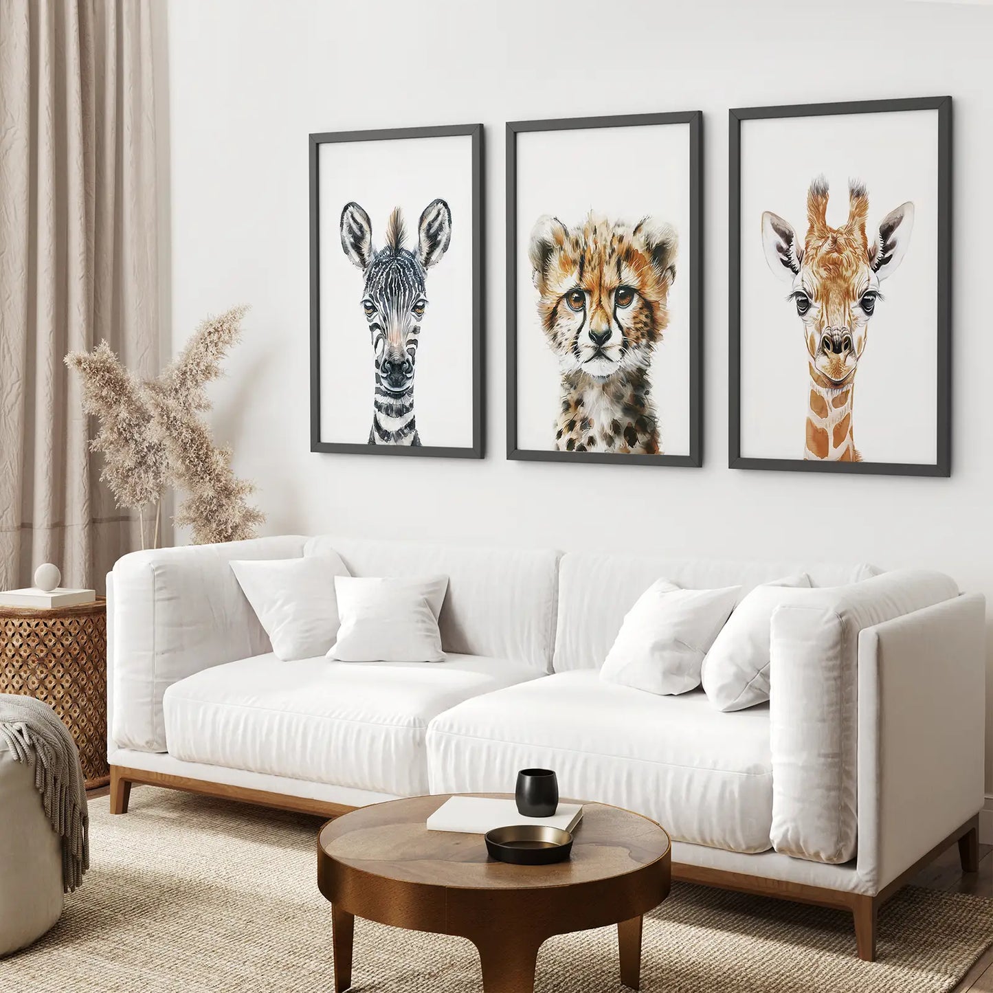 Minimalist safari animal poster set of 3 with zebra, cheetah, and giraffe. Black frames above the sofa.