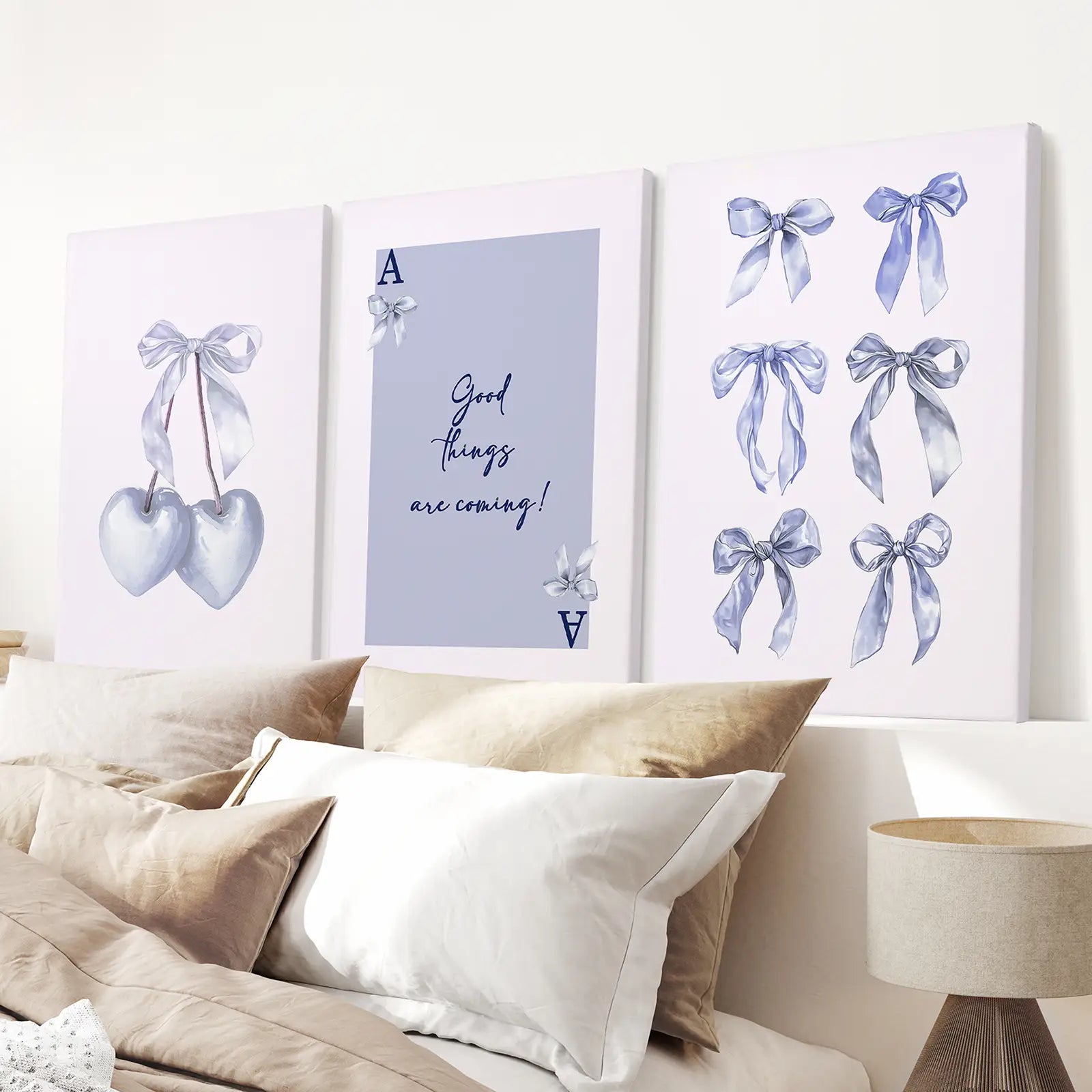 Chic wall art set of 3 with bows and inspirational text print. Stretched canvas above the bed.