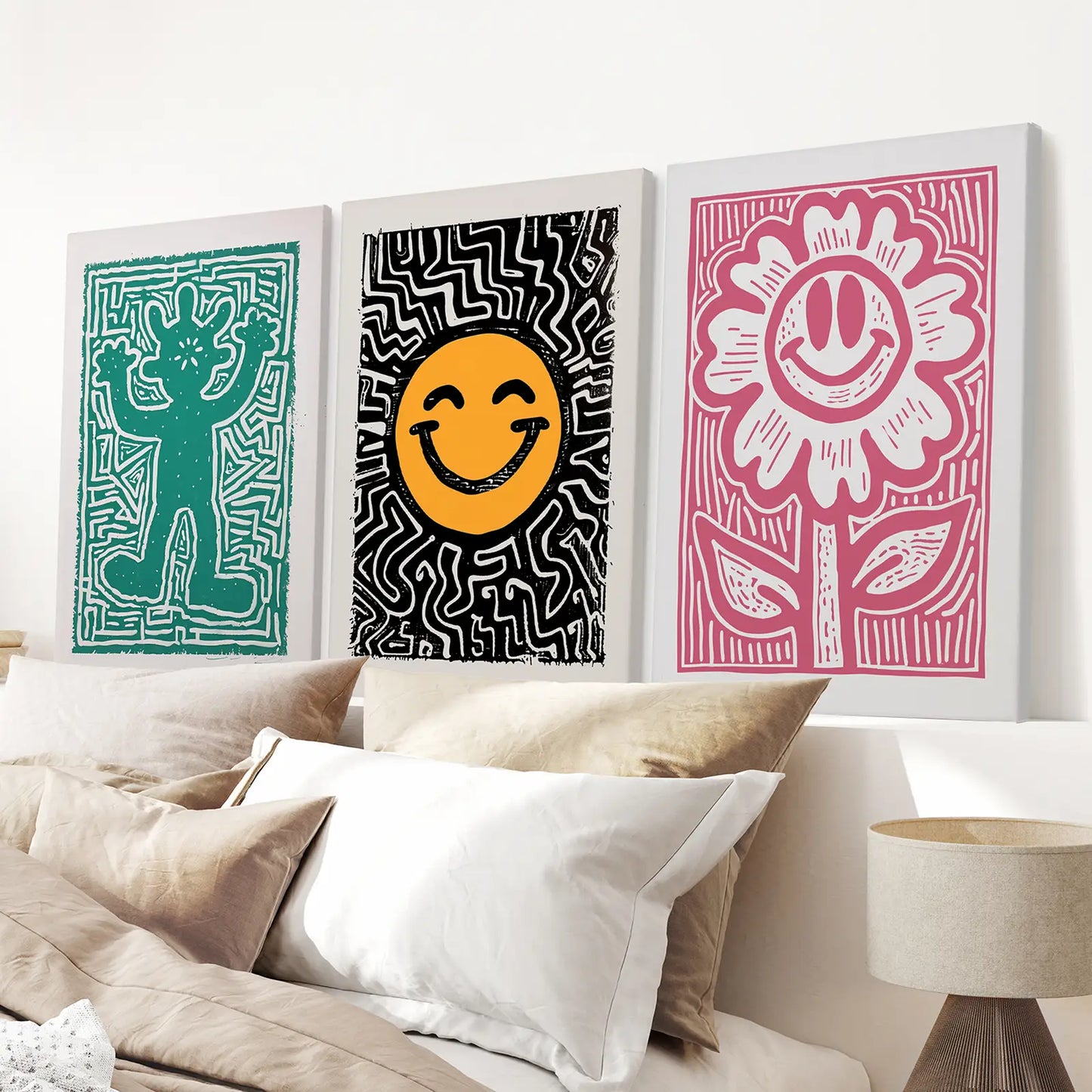 Contemporary wall art set of 3 posters in bold pop art style for modern decor. Wrapped canvas over the bed.