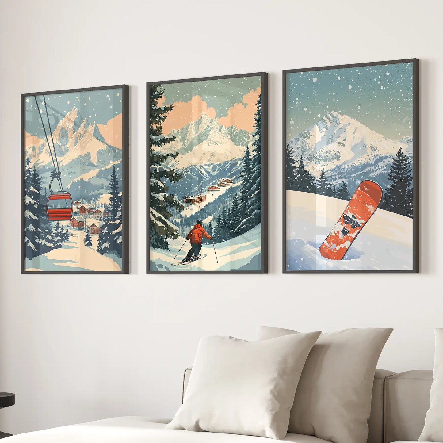 Set of 3 black framed artworks depicting mountain ski sprot. A skier, ski lift and a snowboard on a wall above a sofa.