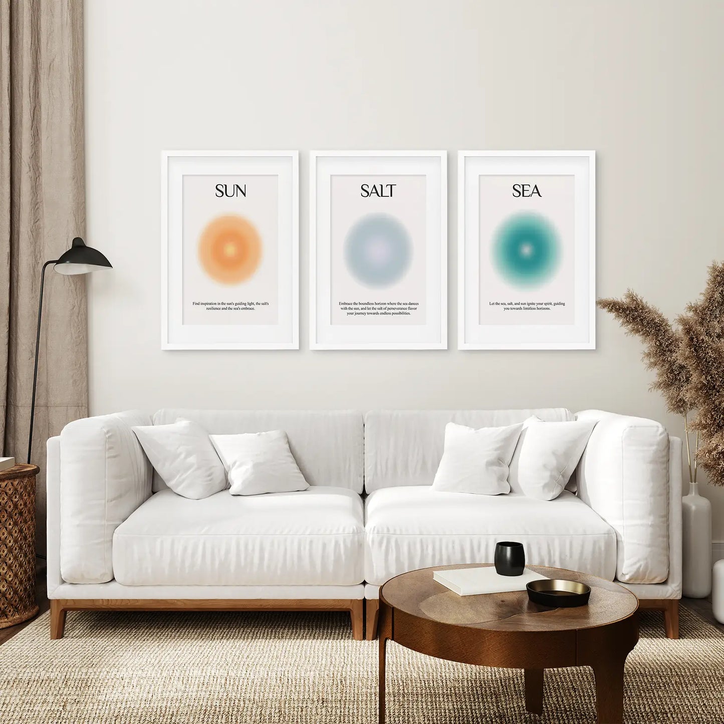 Ocean inspired Sun Salt Sea minimalist art set of 3 prints. White frames with mat above the sofa.