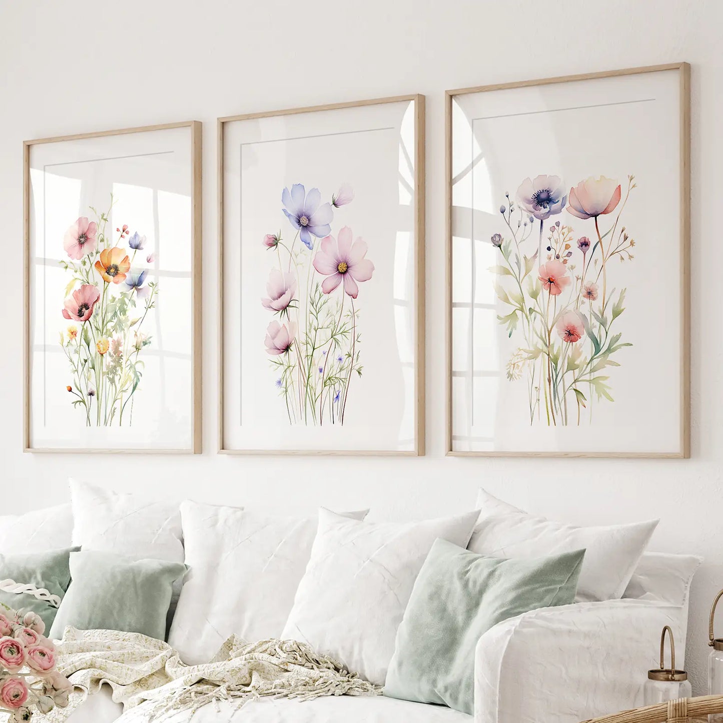 Set of 3 watercolor flower prints pink and purple blossoms. Thinwood frames with mat over the couch.