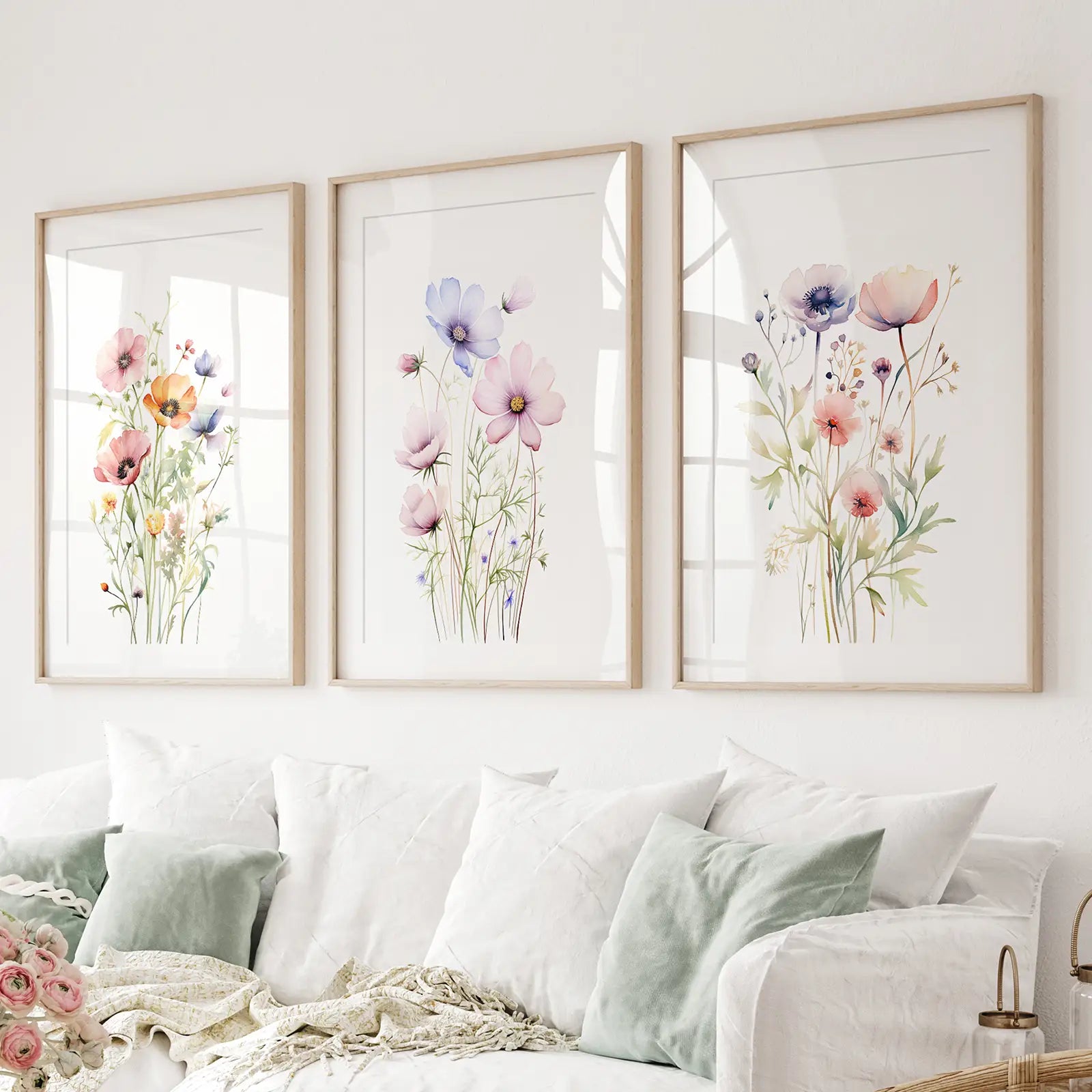 Set of 3 watercolor flower prints pink and purple blossoms. Thinwood frames with mat over the couch.