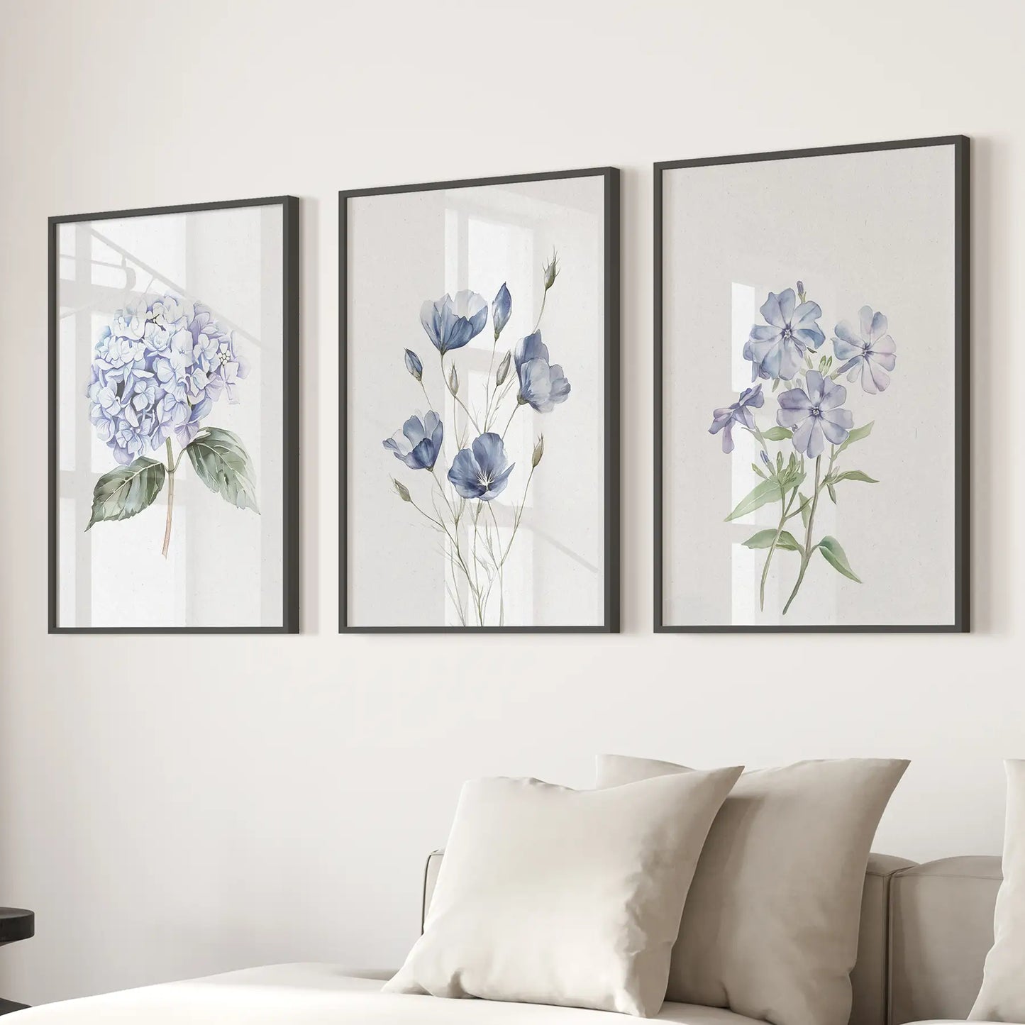 Set of 3 blue watercolor hydrangea prints, floral decor. Black frames above the Sofa.