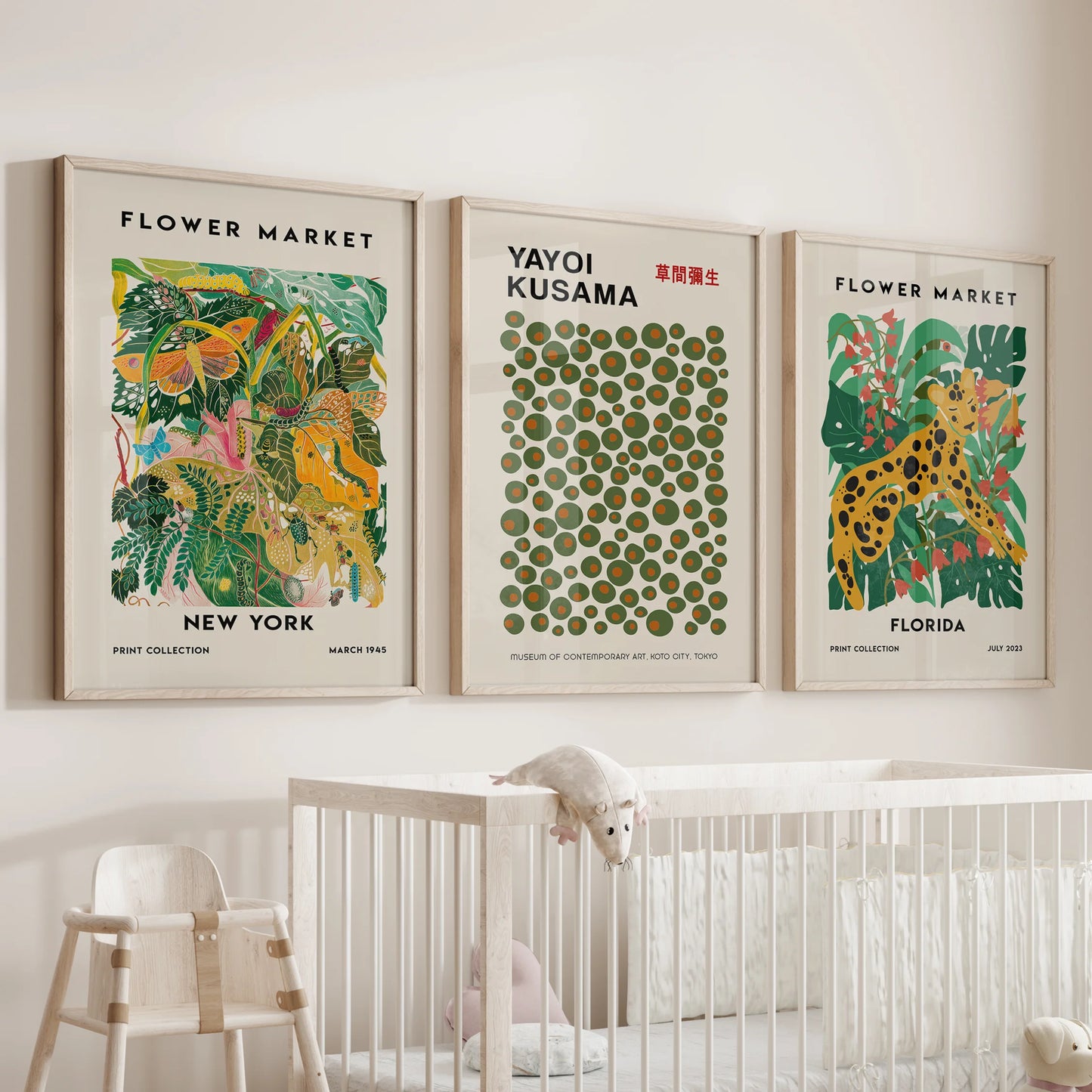 A three-piece set of playful polka-dot art in solid oak frames hangs over the cot, giving the nursery a modern, gentle touch.