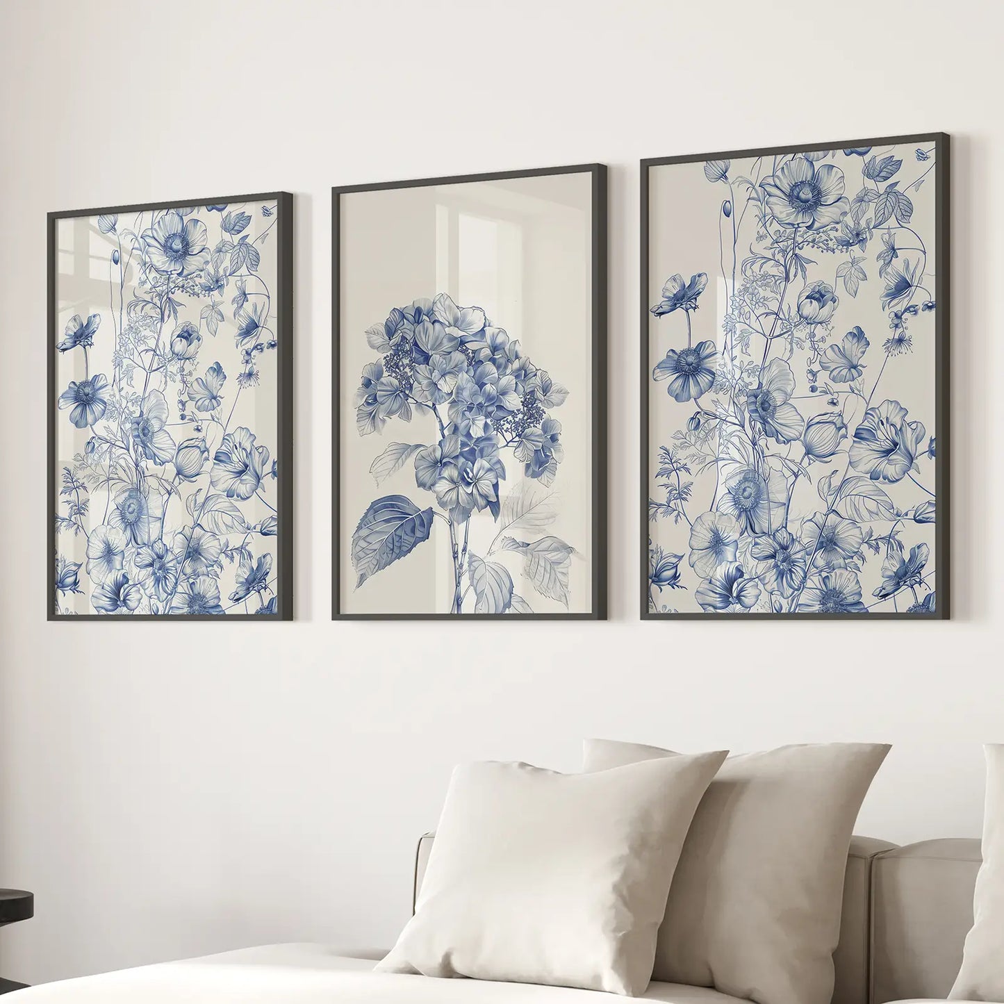 Blue flower triptych wall art prints for elegant home interior. Black frames for living room.