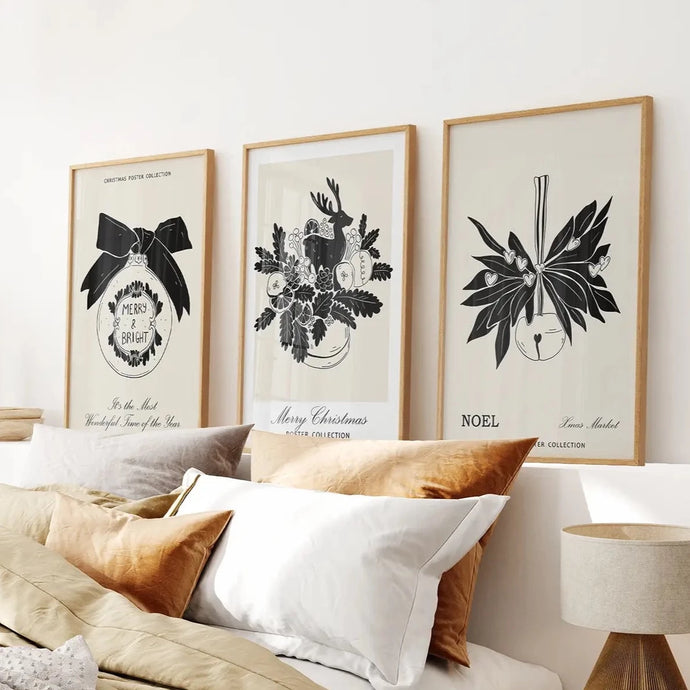 Black Beige Xmas Art Poster Set. Thin Wood Frames Above the Bed.