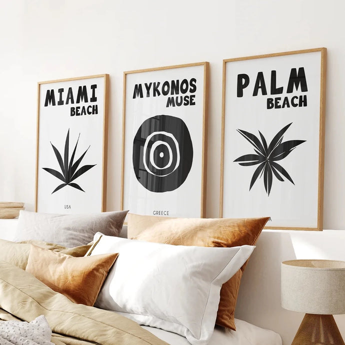 Trendy Travel Poster Art Set. Thin Wood Frames Over the Bed.