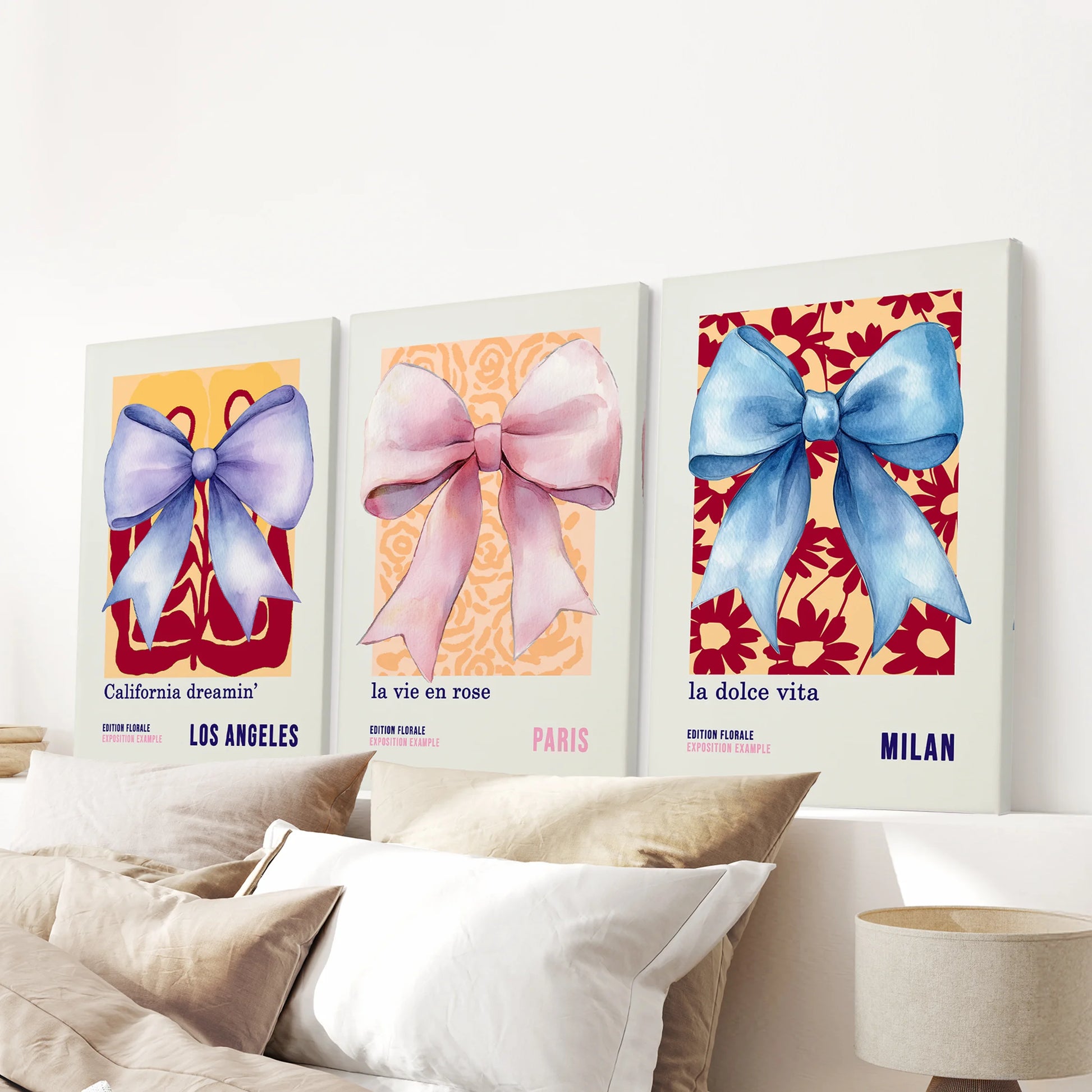 A 3-piece canvas wall art set of coquette bows spans the bedroom headboard, lending gentle curves and subdued color to the space.
