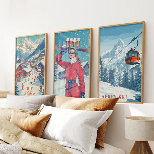 Retro après ski poster print with snowy ski village and skiers. Thinwood frames above the bed.