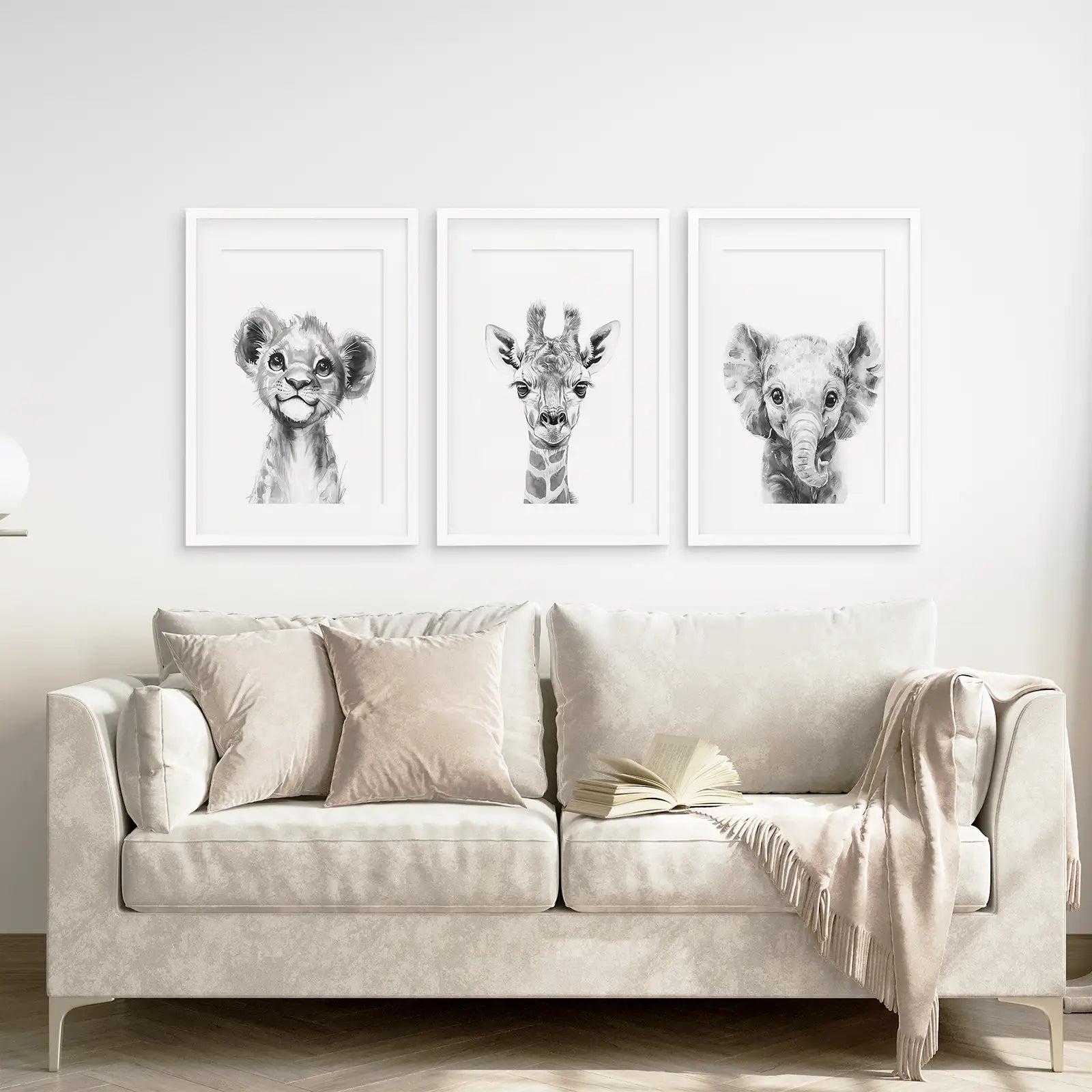 Black and White Safari Nursery Decor Set. White Frames with Mat Above the Sofa.