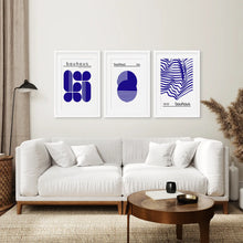 Load image into Gallery viewer, Blue Wall Art Set Abstract Printable Decor. White Frames with Mat Above the Sofa.
