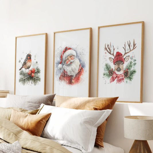 Christmas wall art set of 3 with Santa Claus, reindeer, and robin watercolor prints. Thinwood frames above the bed.