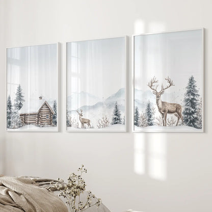 Farmhouse winter wall art with cabin and reindeer design. White frames over the bed.