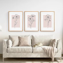 Load image into Gallery viewer, Set of 3 Pink Plant Prints Wall Art. Thinwood Frames with Mat Over the Coach.
