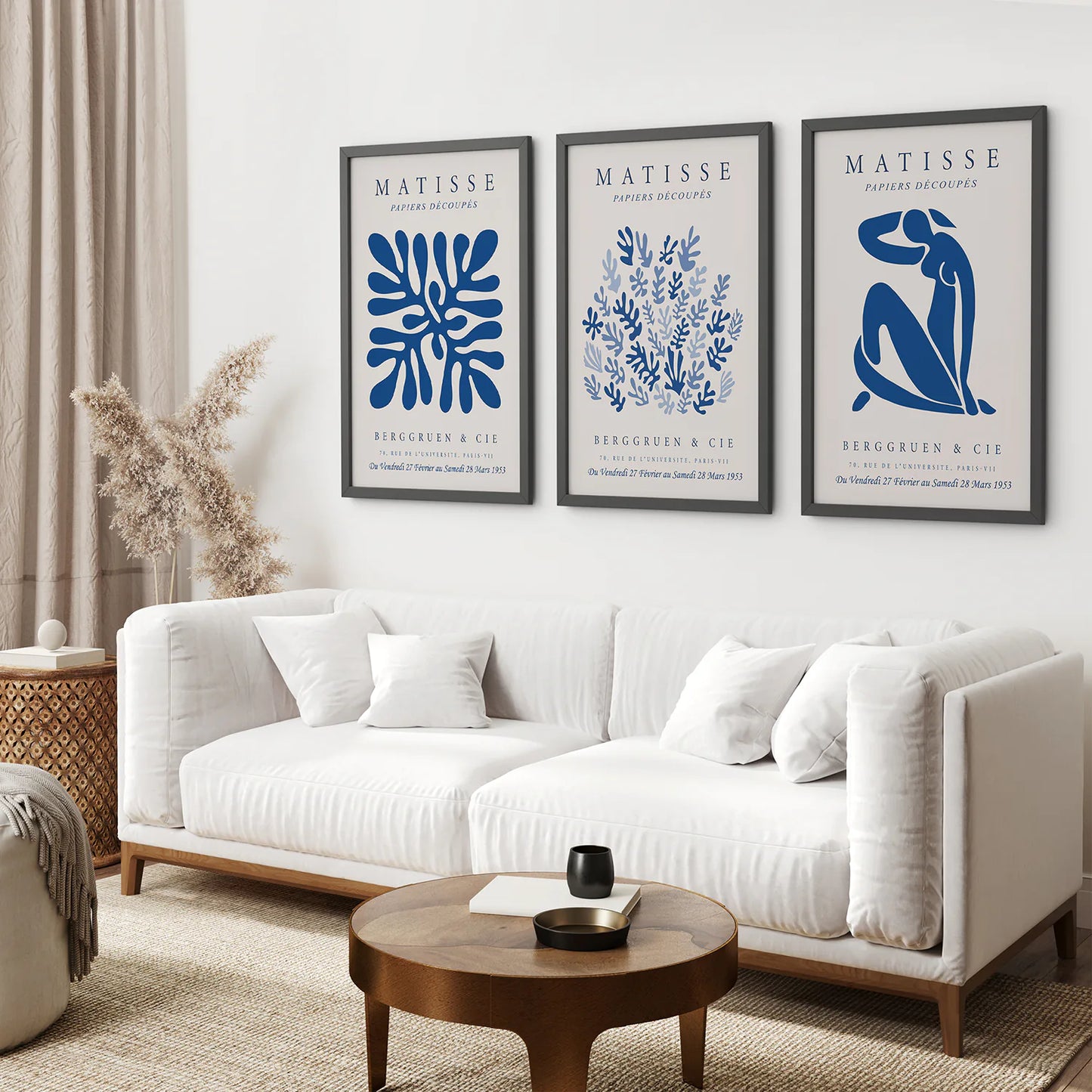 Trendy Navy Blue Matisse Art Set. Black Frames Above the Sofa.