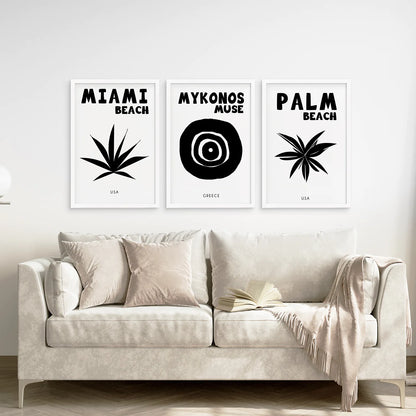 Black and White Travel Set of 3 Prints. White Frames Above the Sofa.