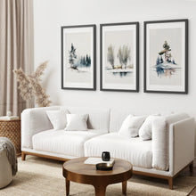 Load image into Gallery viewer, Snowy Forest Watercolor Painting Art Prints. Black Frames with Mat Over the Couch.
