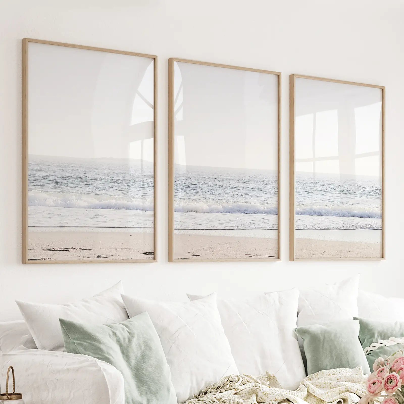 https://wallartset.com/cdn/shop/files/Minimalist-Beach-Wave-Photo-3-Piece-Wall-Art-W025-thin-wood-frame-above-couch.webp?v=1714670693