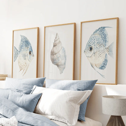 Blue fish poster bathroom wall decor. Summer wall art. Thinwood frames above the bed.