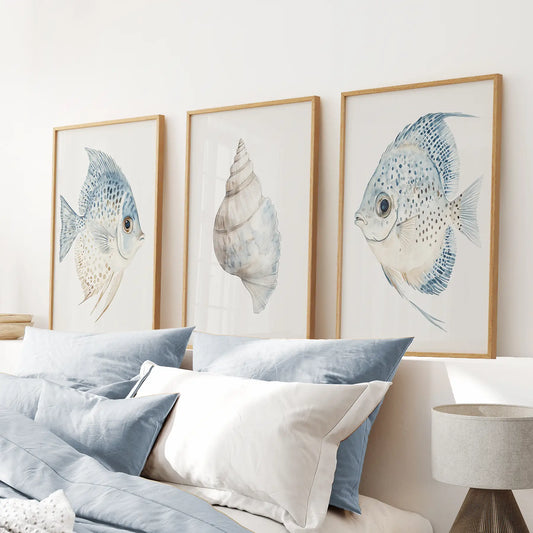 Blue fish poster bathroom wall decor. Summer wall art. Thinwood frames above the bed.