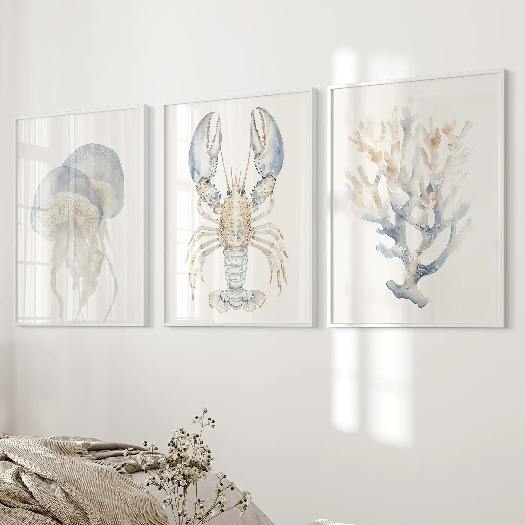 Jellyfish, lobster, coral marine wall art. Ocean animals artwork. White frames over the bed.