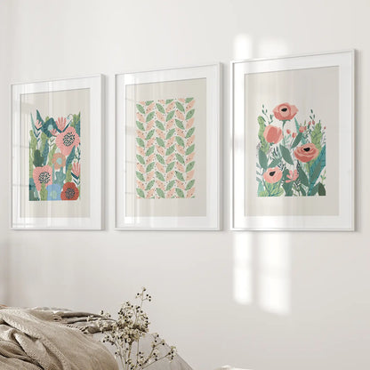 Trendy Pink Meadow Wildflowers Print Set. White Frames with Mat Above the Bed.