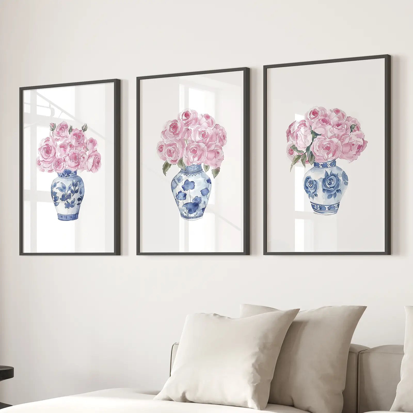 Minimalist Watercolor Roses New Apartment Decor. Black Frames Above the Sofa.