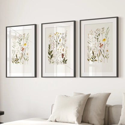 Pressed fower prints. Home decor wall art poster. Black frames with mat over the couch.