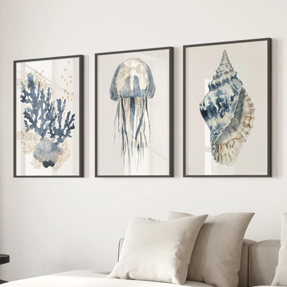 Vertical art jellyfish print blue ocean decor. Beachy watercolor prints. Black frames above the sofa.