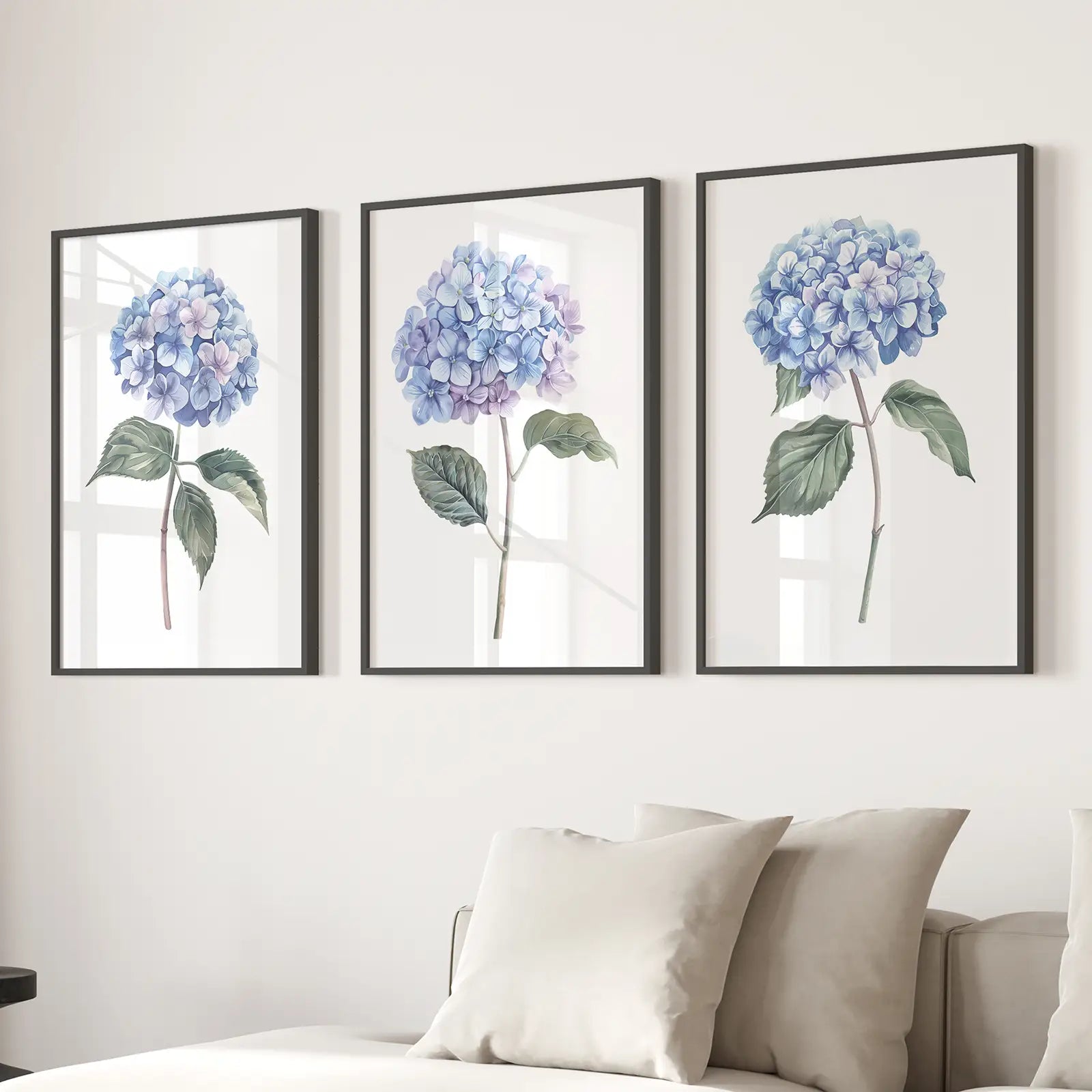 Blue Wall Art Trendy Flowers Apartment Decor. Black Frames Above the Sofa.