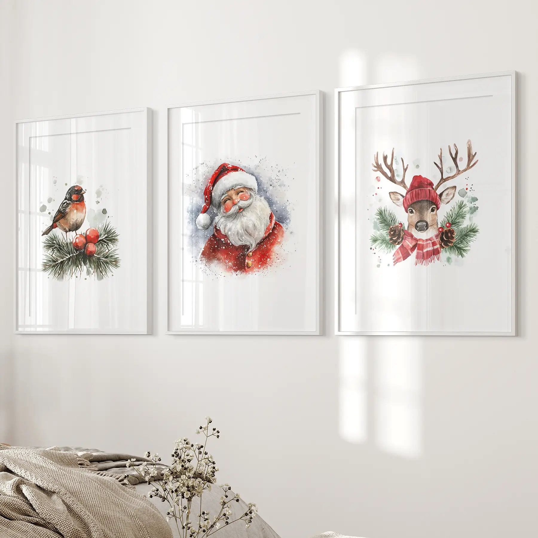 Robin bird watercolor print with pine branches and berries, Christmas wall art. White frames with mat above the bed.