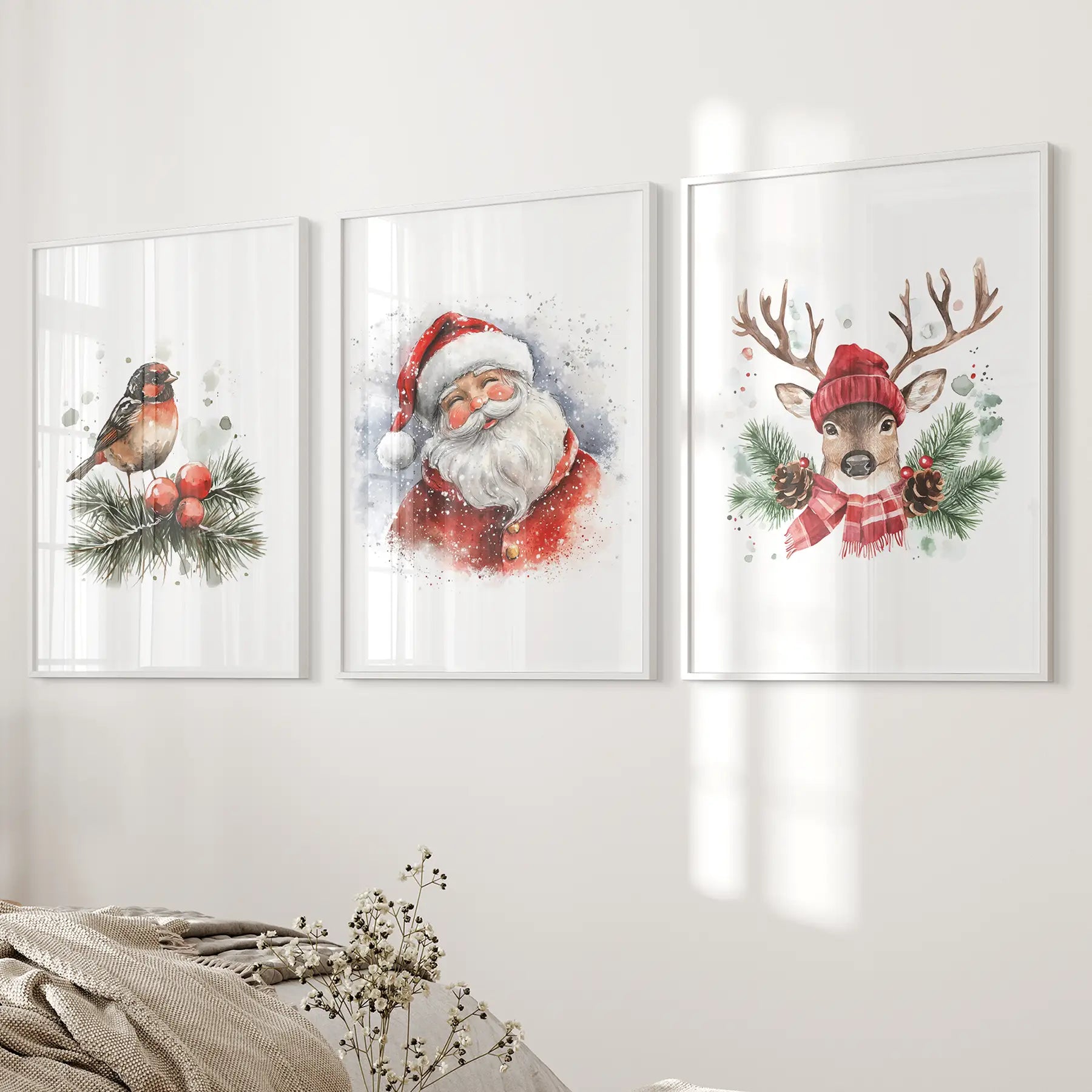 Watercolor reindeer Christmas artwork, perfect for holiday gift decor. White frames over the bed.